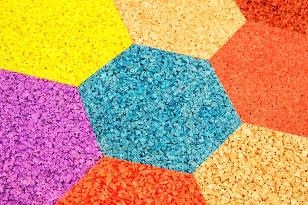 Multicolor hexagons abstract pattern rubber crumb texture\
background flooring for stadiums and playgrounds