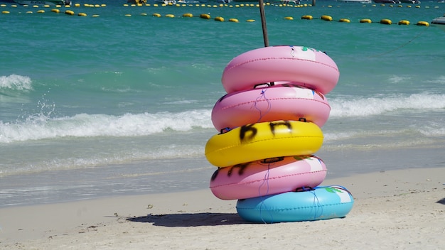 Multicolor Lifebuoy on the beach