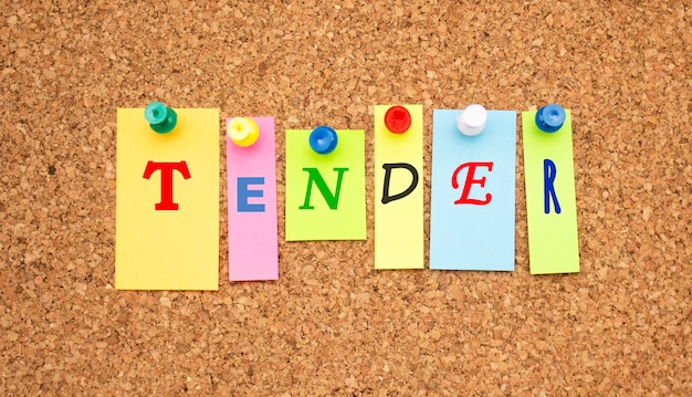 Multicolor notes with letters pinned on a cork notice board