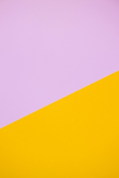 Multicolor paper background in pink and yellow