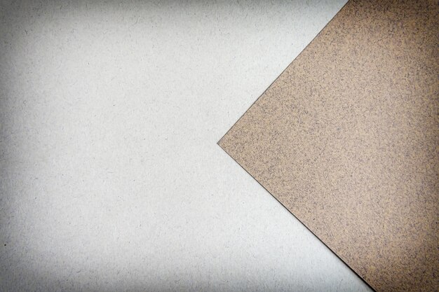 Photo multicolor paper diagonal background with brown colors. top view, copy space. with vignette