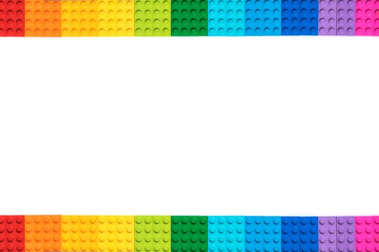 Multicolor Plastick constructor bricks on white background. Popular toys. Copyspace