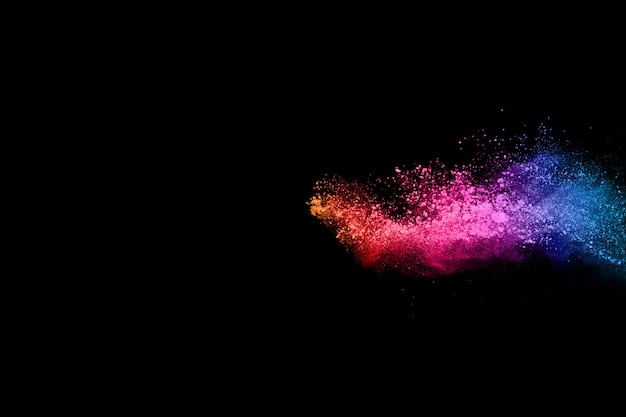 Multicolor powder explosion on black background.  