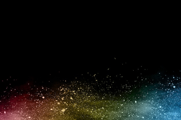 Multicolor powder explosion on black background.  