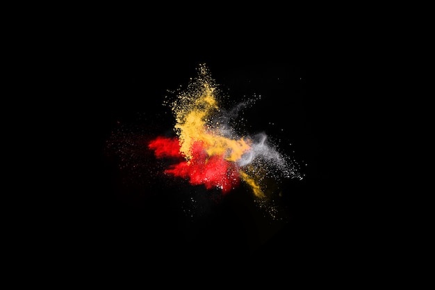 Multicolor powder explosion on black background. 