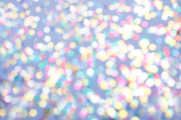 Multicolor sparkles on a purple background Festive backdrop for your projects