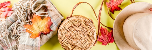 Multicolored autumn background with hat, plair and bag