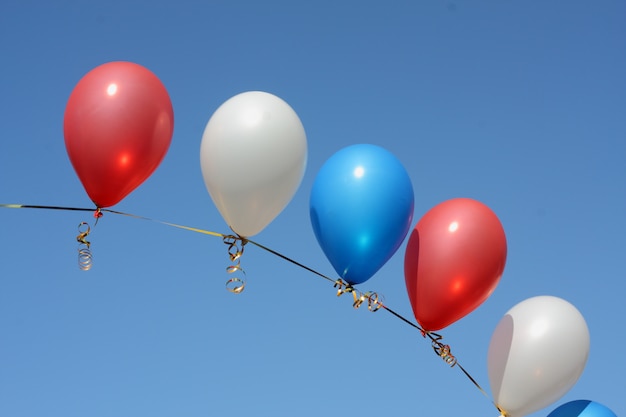 Multicolored balloons against the sky