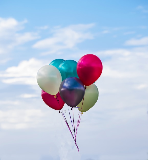 Multicolored balloons, sky background, concept of happy birthday in summer and wedding honeymoon party