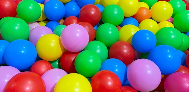 Multicolored balls for a dry pool for children to play in the house and outdoors the concept of