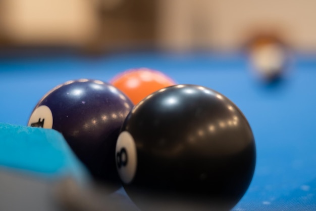 Multicolored billiards billiard balls on a blue table colored balls on a billiard table play snooket