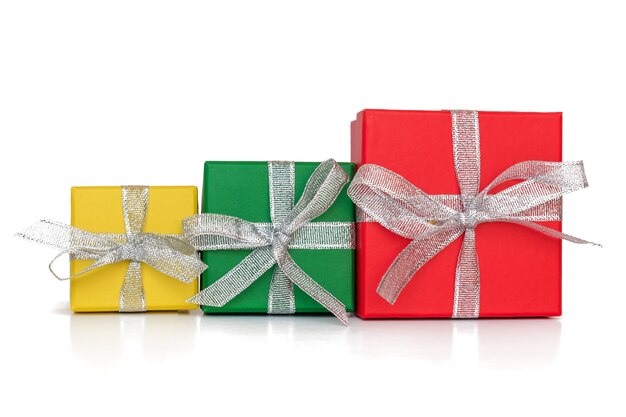 Multicolored boxes wrapped in recycled paper with ribbon