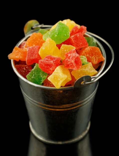 Multicolored candied fruits in a bucket