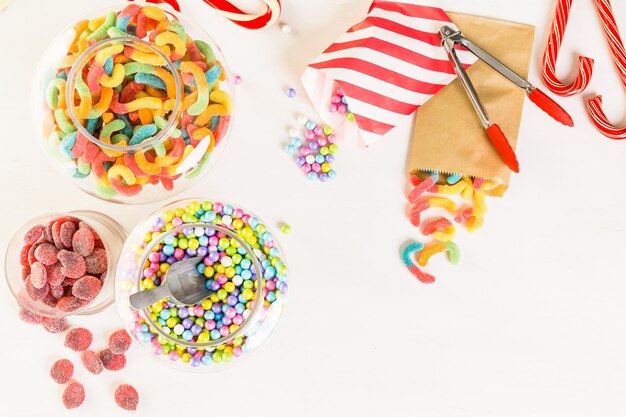 Multicolored candies on a white table.