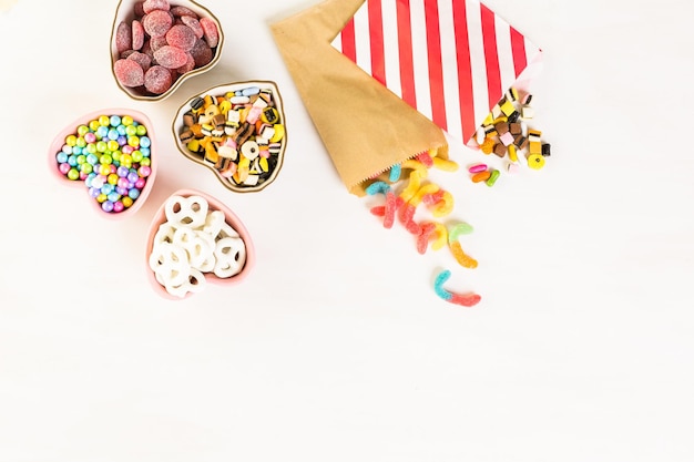 Multicolored candies on a white table.