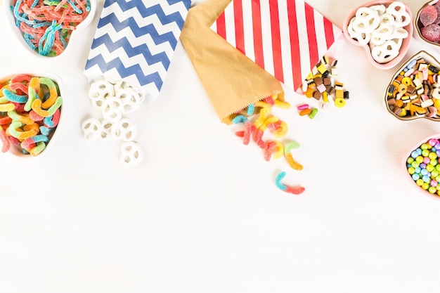 Multicolored candies on a white table.