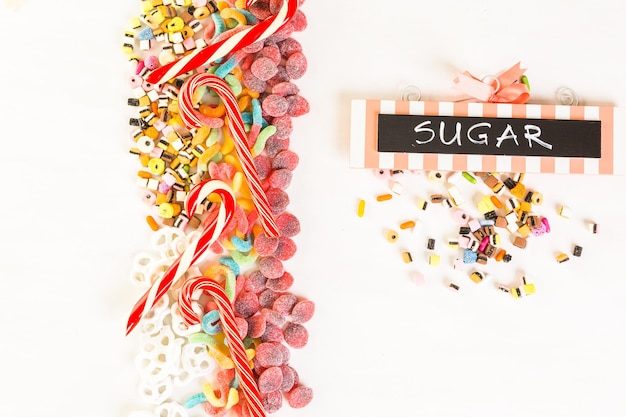 Multicolored candies on a white table.