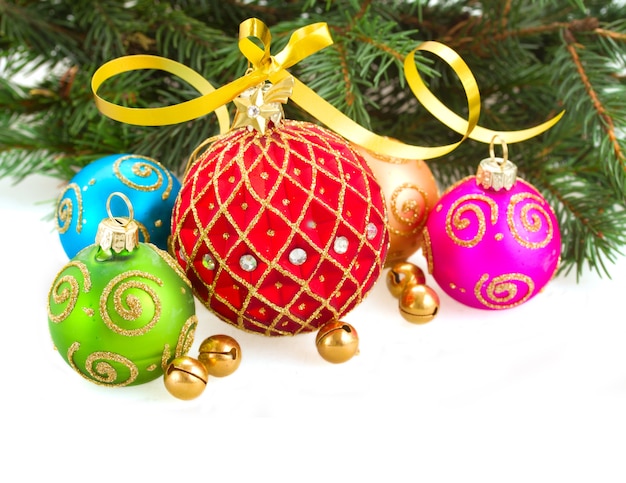Multicolored christmas balls with evergreen tree isolated