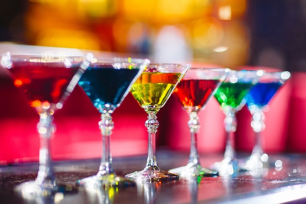 Multicolored cocktails at the bar.