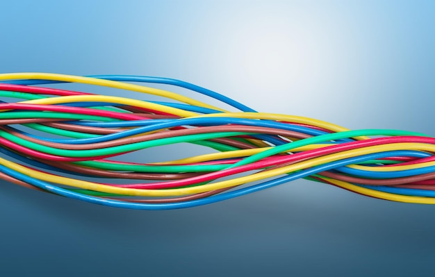 Multicolored computer cables on blue background