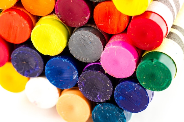 Multicolored crayons on a white background.