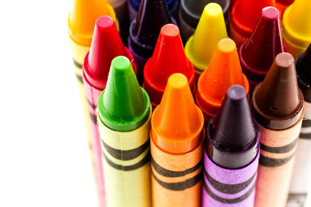 Multicolored crayons on a white background.