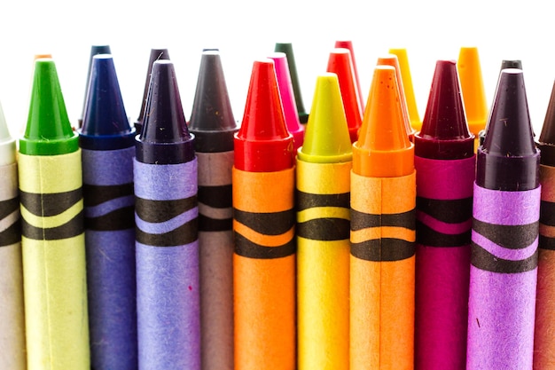 Multicolored crayons on a white background.