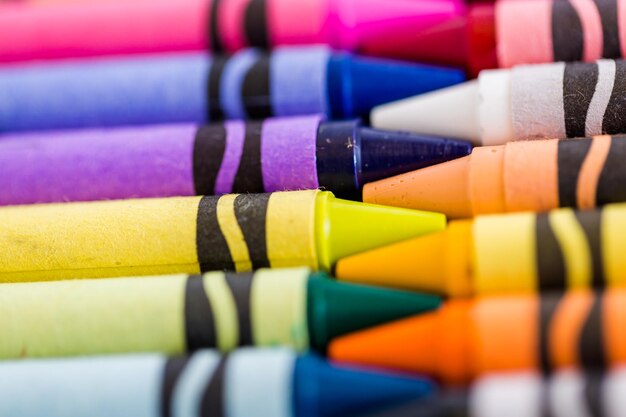 Multicolored crayons on a white background.