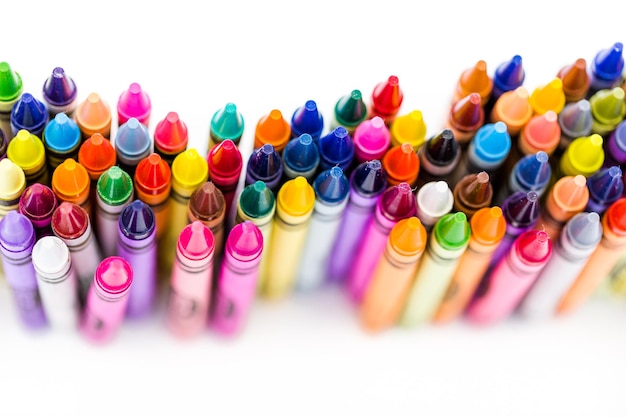 Multicolored crayons on a white background.