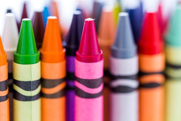 Multicolored crayons on a white background.