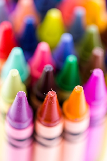 Multicolored crayons on a white background.