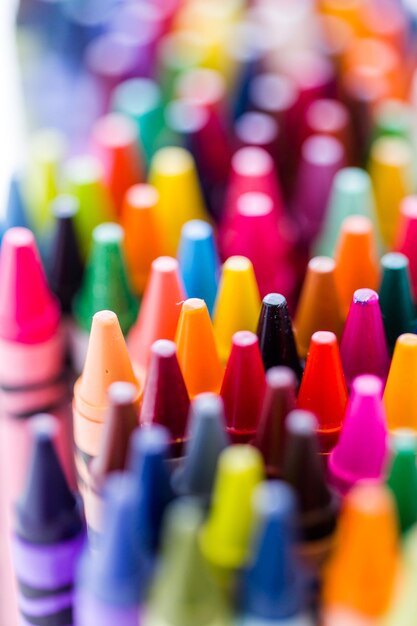 Multicolored crayons on a white background.