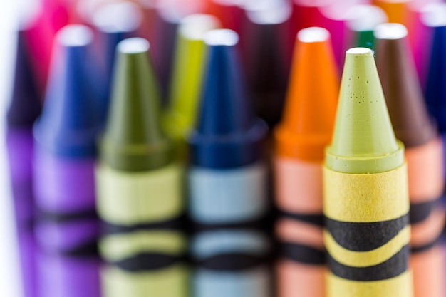 Multicolored crayons on a white background.