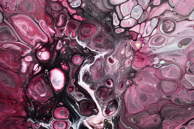 Multicolored creative abstract background Pink black alcohol ink Waves stains spots and strokes of paint marble texture