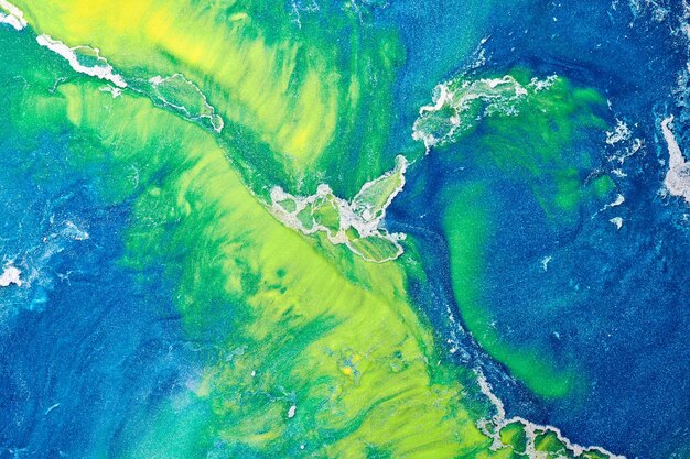 Multicolored creative abstract background Texture of acrylic paint Stains and blots of alcohol ink green blue yellow colors fluid artxA