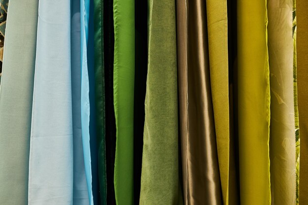 multicolored curtains in the store texture of multicolored fabrics fabric hanging in the store