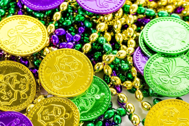 Multicolored decorations for Mardi Gras party on the table.