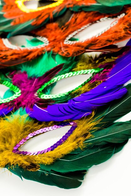 Multicolored decorations for Mardi Gras party on the table.