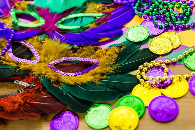 Multicolored decorations for Mardi Gras party on the table.