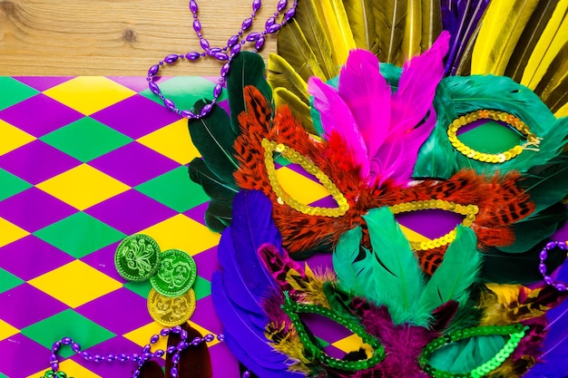 Multicolored decorations for Mardi Gras party on the table.