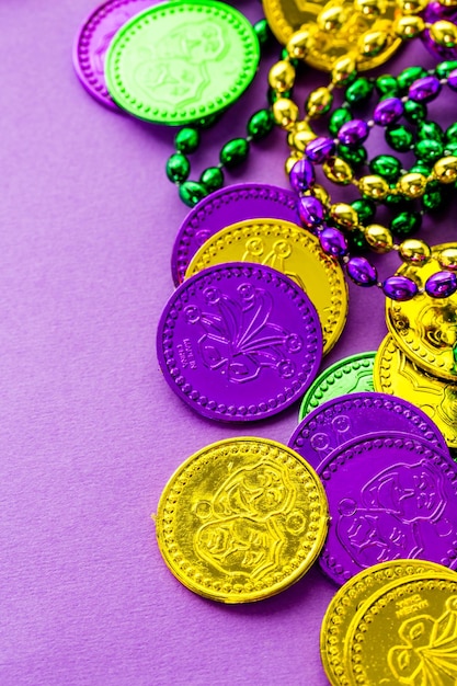 Multicolored decorations for Mardi Gras party on the table.