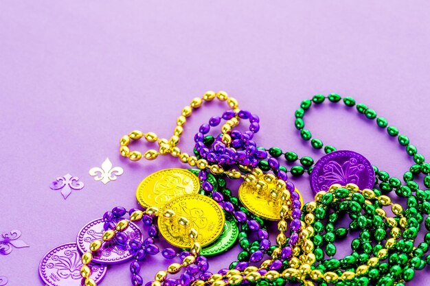 Multicolored decorations for Mardi Gras party on the table.