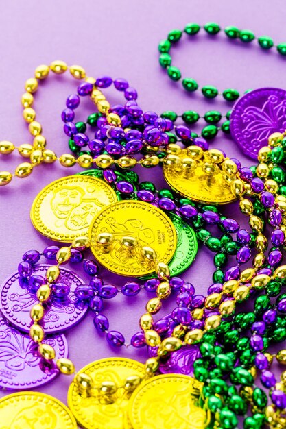 Multicolored decorations for Mardi Gras party on the table.