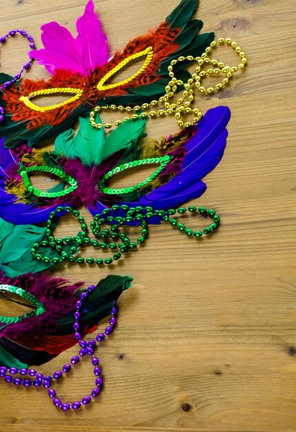 Multicolored decorations for Mardi Gras party on the table.