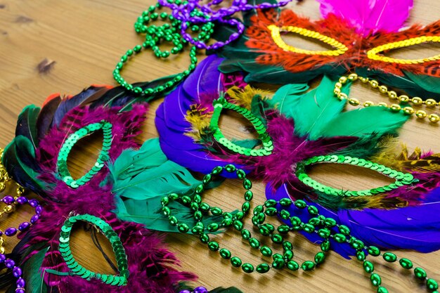 Multicolored decorations for Mardi Gras party on the table.