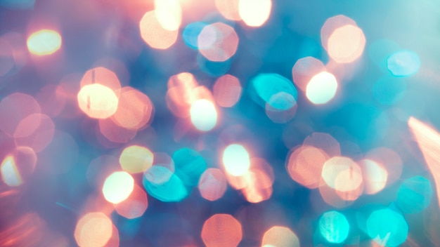 Multicolored defocused bokeh lights background - horizontal wallpaper, poster. Stylish, festive and elegance shot. Trendy colors. Illuminated, lights, glitter effects. Celebrative decoration.