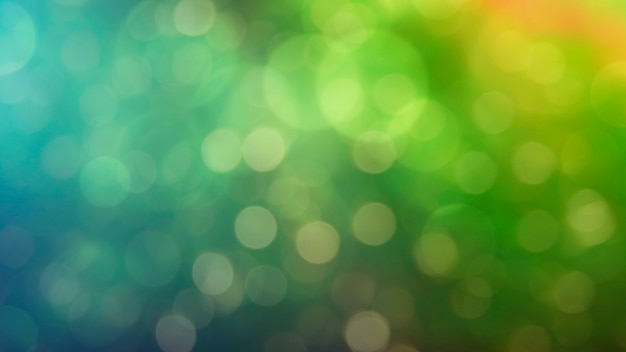 Multicolored defocused bokeh lights background - horizontal wallpaper, poster. Stylish, festive and elegance shot. Trendy colors. Illuminated, lights, glitter effects. Celebrative decoration.