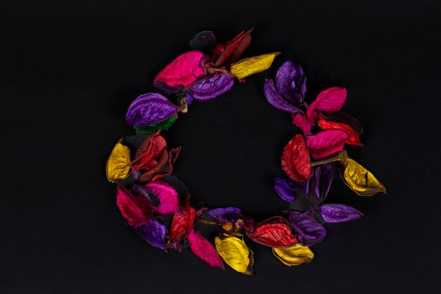 Multicolored dry petals on a black background