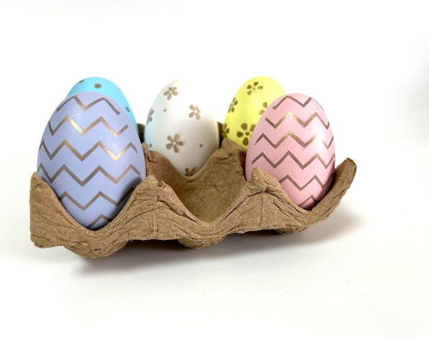 Multicolored festive eggs on a light background