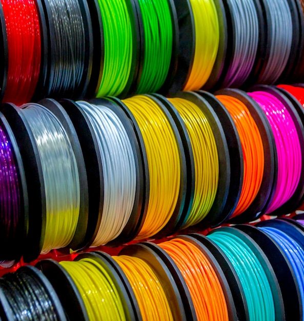 Multicolored filaments of plastic for printing on d printer closeup